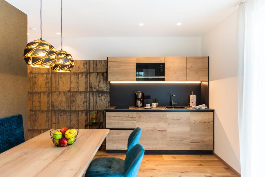 Kuchyň nebo kuchyňský kout v ubytování Marlingsuites