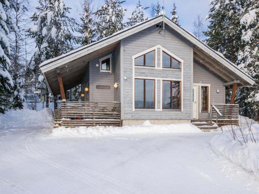a tiny house in the snow in the woods at Holiday Home Rinteenkotka cottage by Interhome in Hyrynsalmi