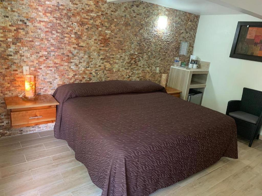 Postel nebo postele na pokoji v ubytování Bon Jesus Hotel