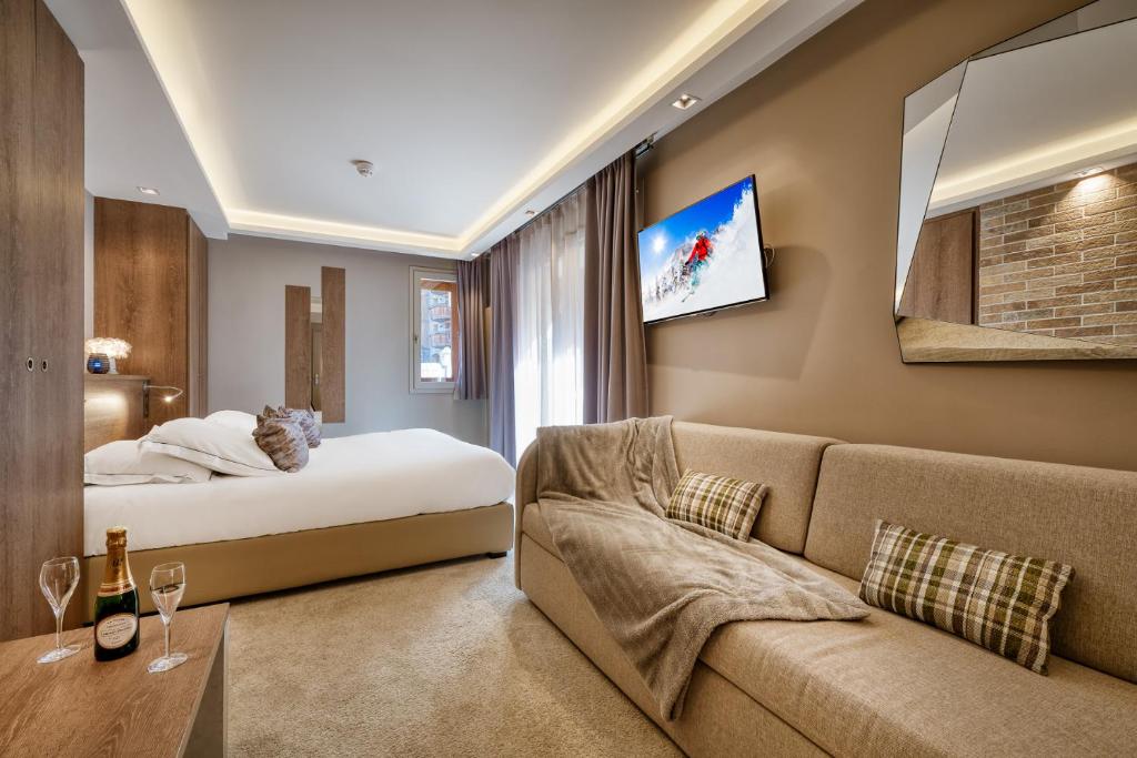 TV a/nebo společenská místnost v ubytování Hotel Le Tremplin