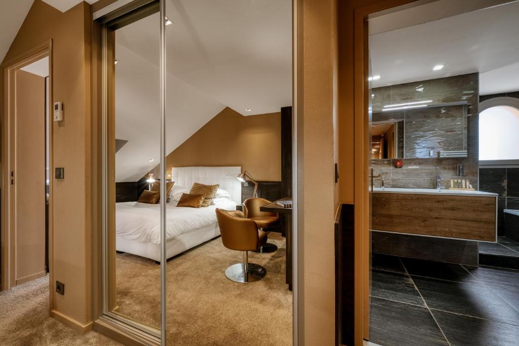 Postel nebo postele na pokoji v ubytování Hotel Le Tremplin