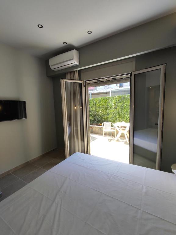 Postel nebo postele na pokoji v ubytování Stefani apartments