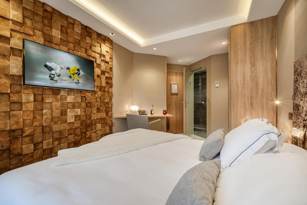 Postel nebo postele na pokoji v ubytování Hotel Le Tremplin