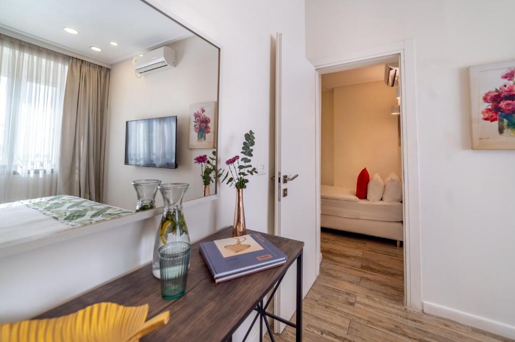 Postel nebo postele na pokoji v ubytování Paamonim Hotel Jerusalem