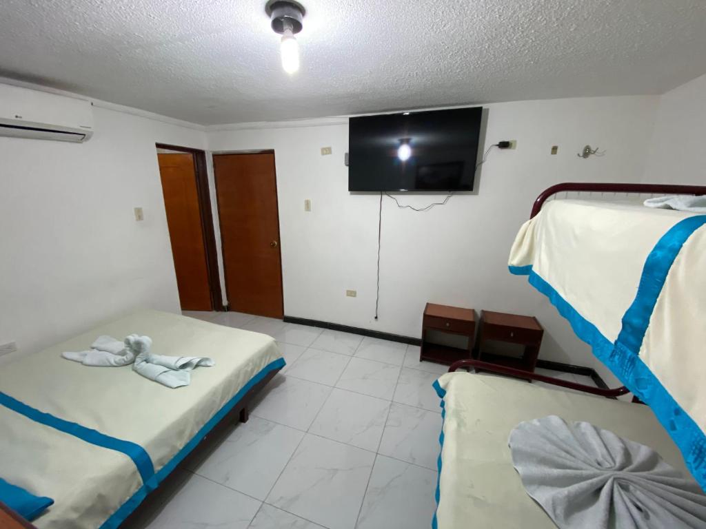 Postel nebo postele na pokoji v ubytování Hotel Maratea Melgar