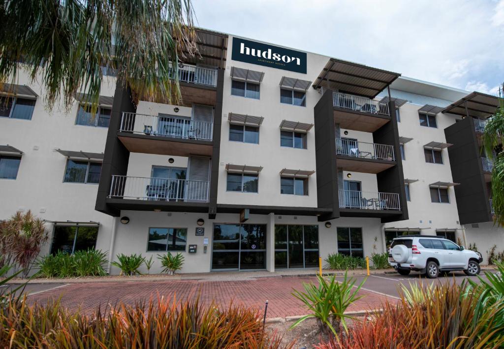 a large white building with a sign on the side of it at Hudson Parap in Darwin