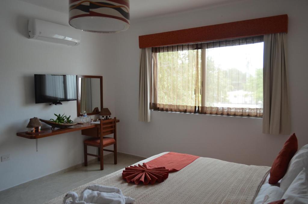 Postel nebo postele na pokoji v ubytování Hotel Real Mercedes
