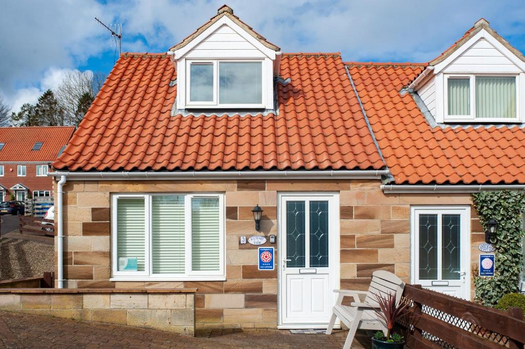 a small house with an orange roof at Estuary View in Whitby