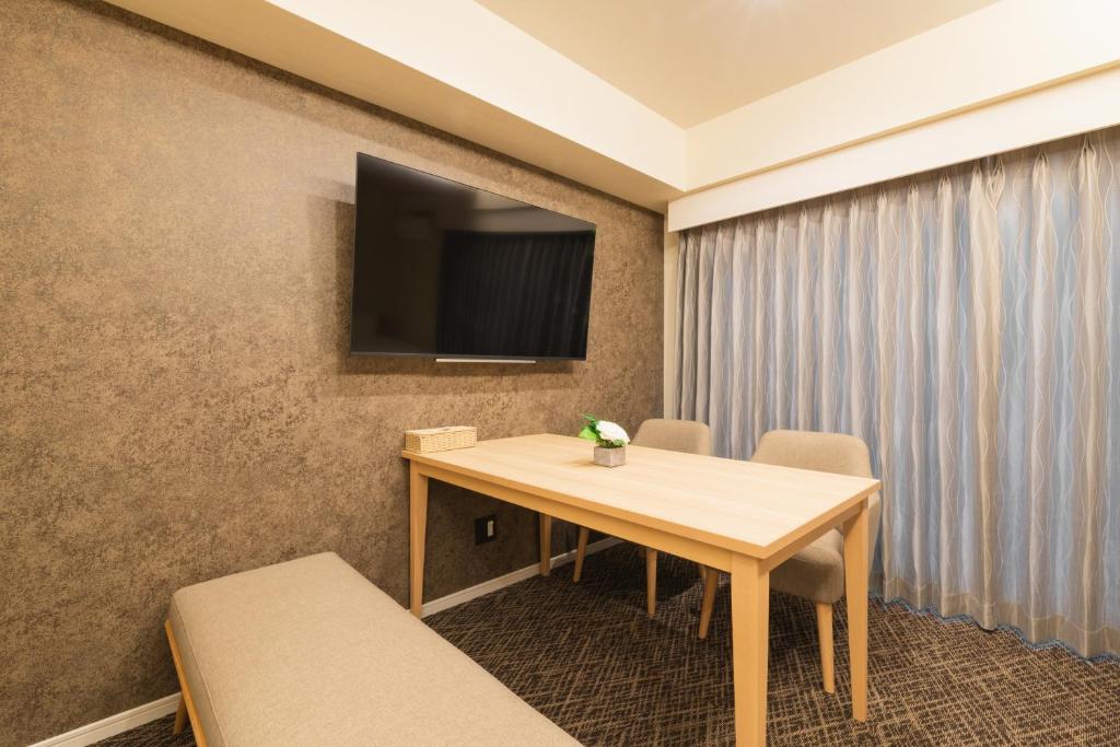 TV a/nebo společenská místnost v ubytování HOTEL WA HAKATA