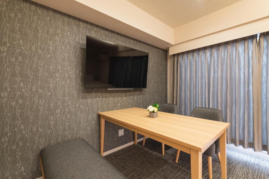 TV a/nebo společenská místnost v ubytování HOTEL WA HAKATA