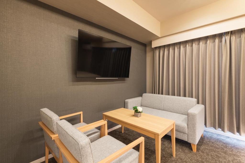 TV a/nebo společenská místnost v ubytování HOTEL WA HAKATA