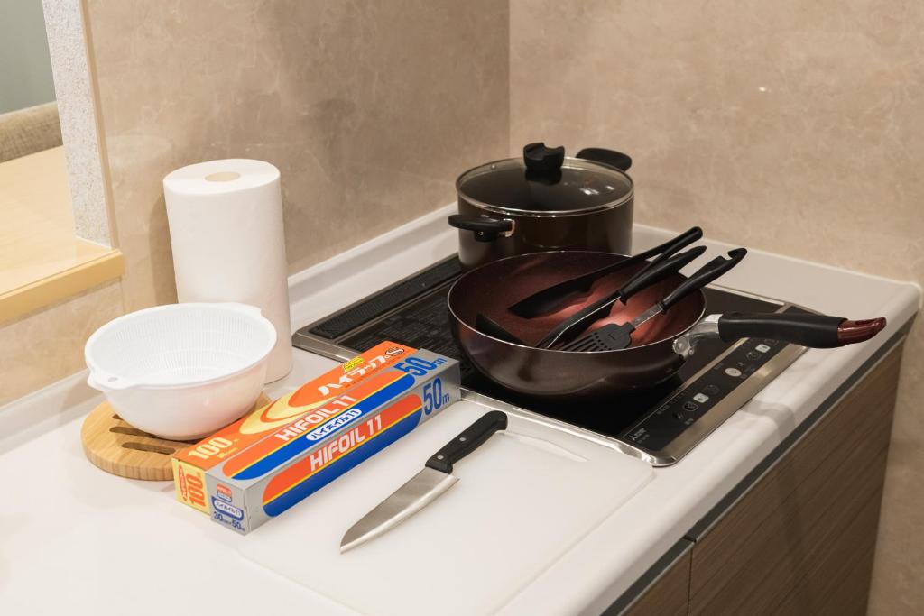 Kuchyň nebo kuchyňský kout v ubytování HOTEL WA HAKATA