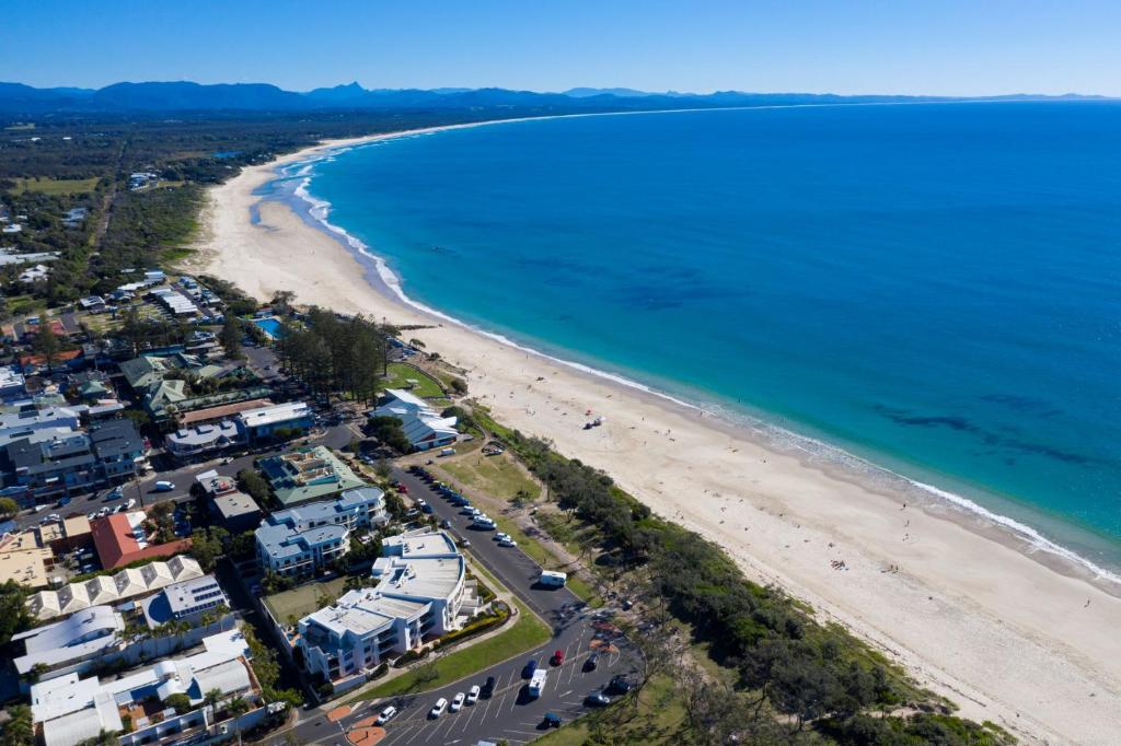 an aerial view of a beach and the ocean at Bay Royal Apartments in Byron Bay