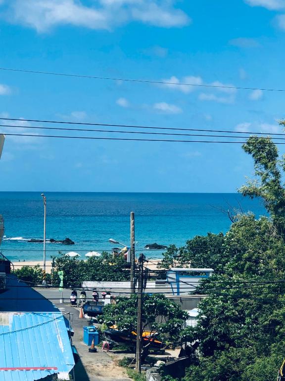 a view of a beach with the ocean in the background at 海灘戀情 Beach Love 近沙灘-國旅卡特約商店 in Eluan