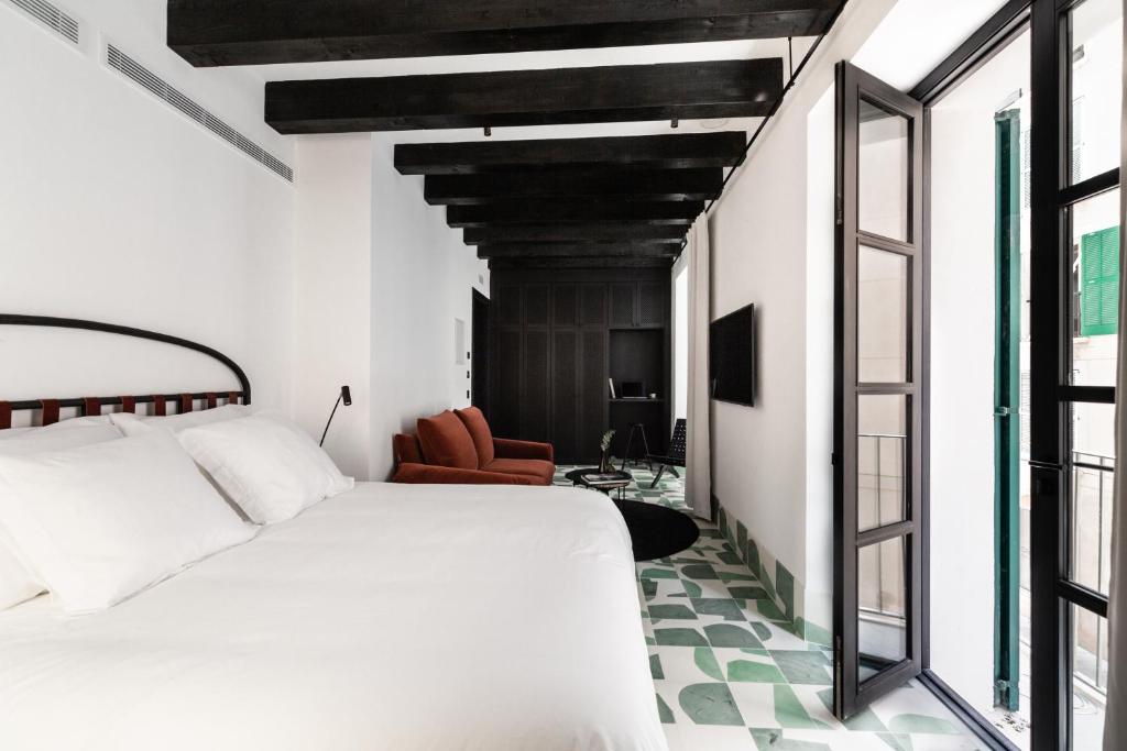 Posteľ alebo postele v izbe v ubytovaní Concepcio by Nobis, Palma, a Member of Design Hotels
