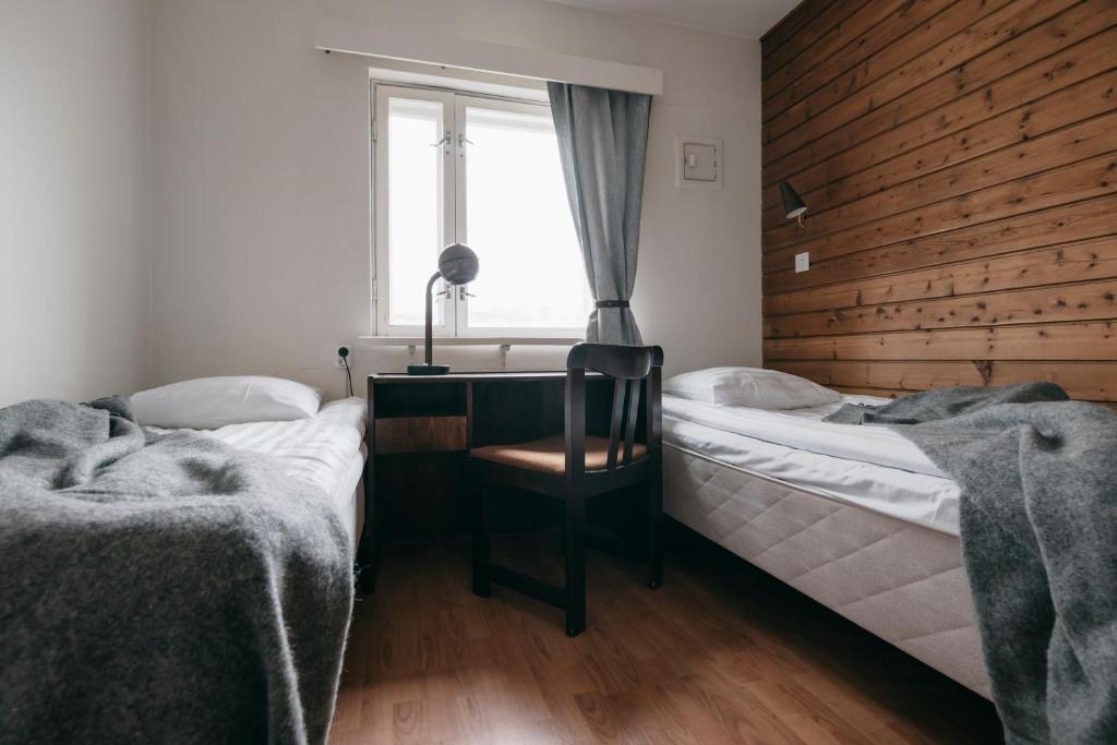 Postel nebo postele na pokoji v ubytování Lapland Hotels Kilpis