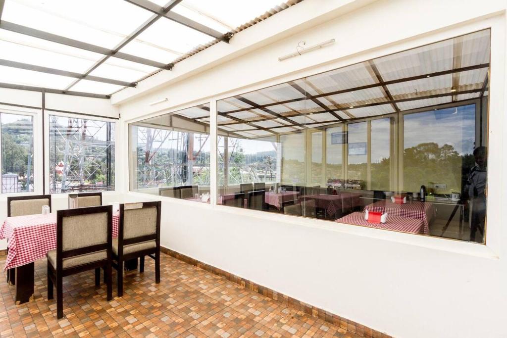 Balkón nebo terasa v ubytování FabHotel Sholas Residency I - Nr Government Rose Garden
