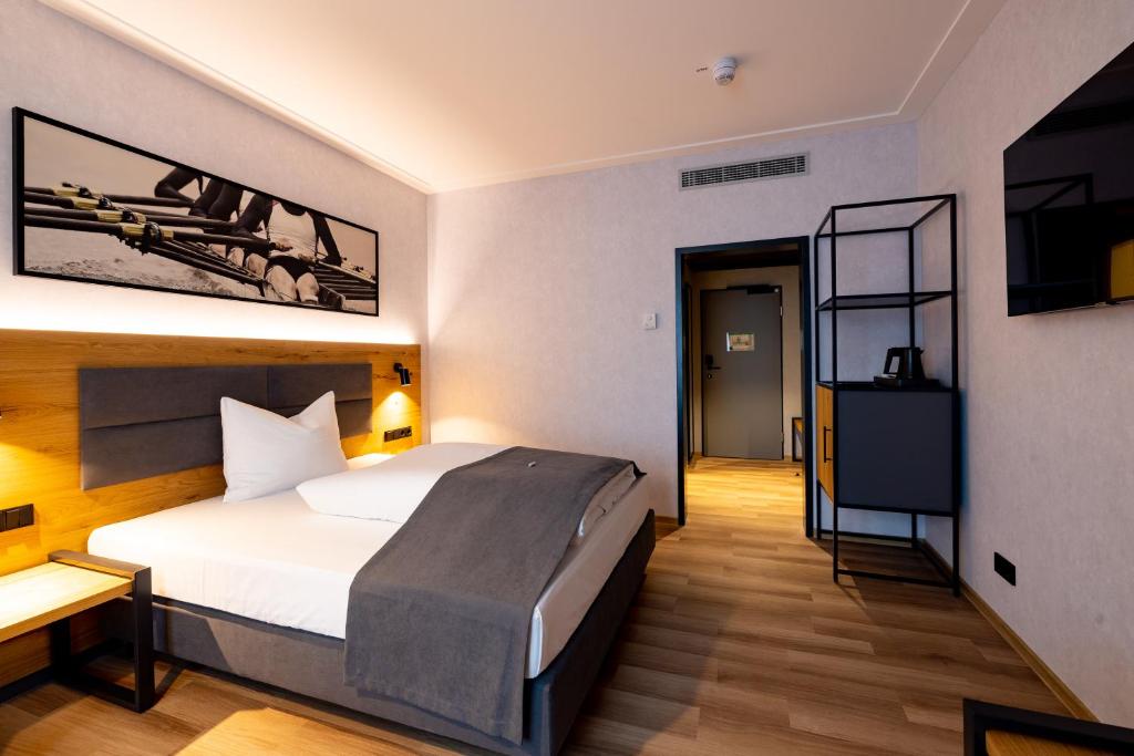 Postel nebo postele na pokoji v ubytování mk hotel passau