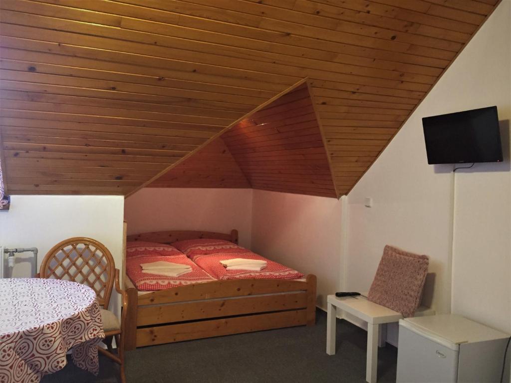 Postel nebo postele na pokoji v ubytování Penzion Na Vyhlídce