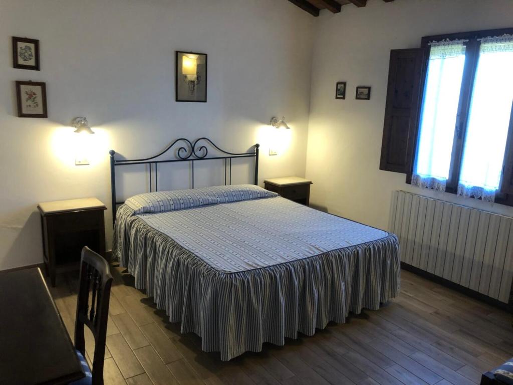 Postel nebo postele na pokoji v ubytování Agriturismo Fattoria Di Corsano