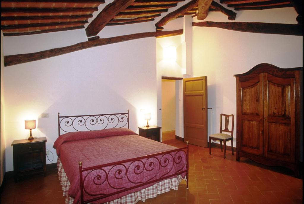 Postel nebo postele na pokoji v ubytování Agriturismo Fattoria Di Corsano