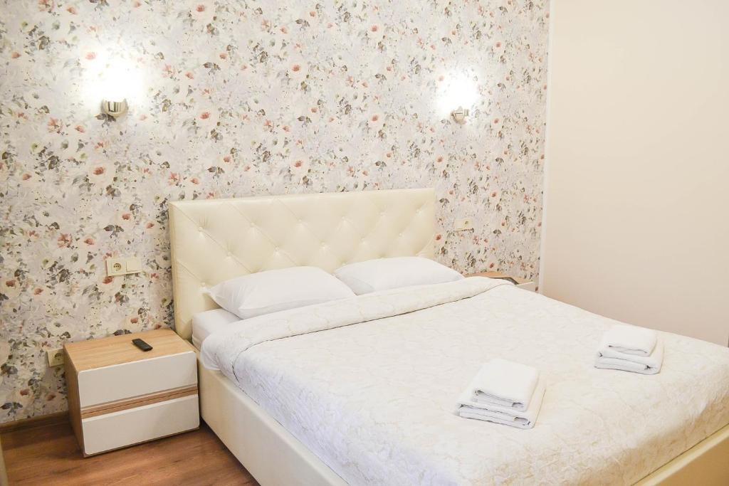 Postel nebo postele na pokoji v ubytování CentrRoomKiev