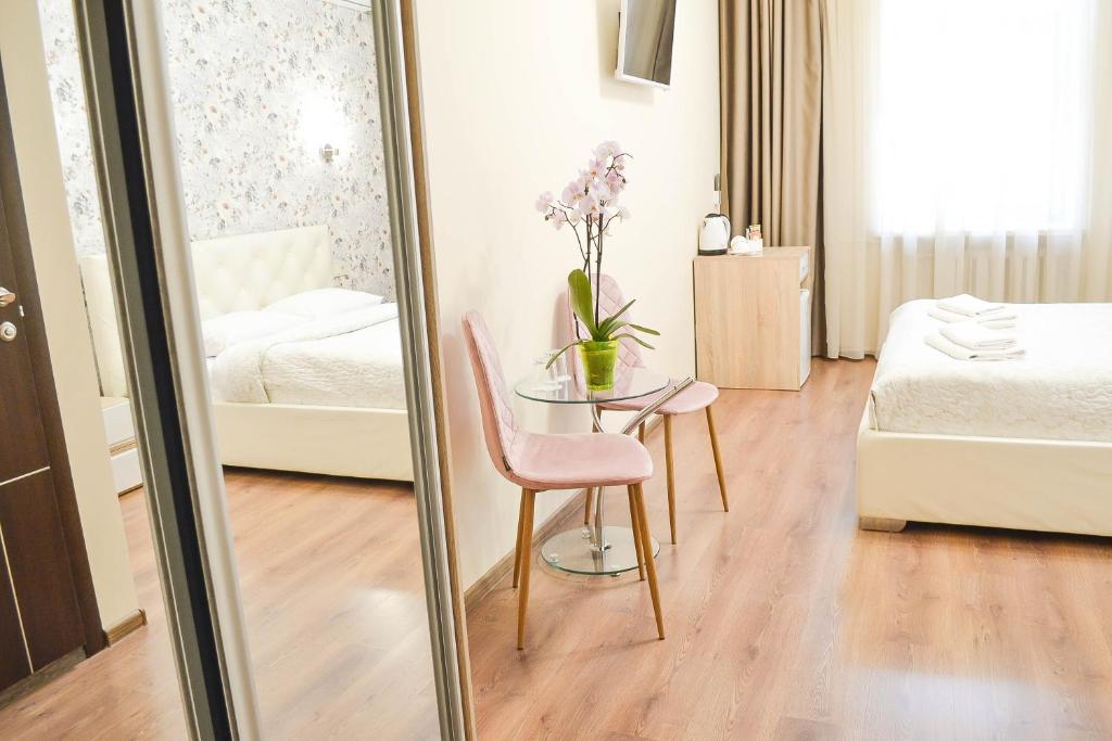Postel nebo postele na pokoji v ubytování CentrRoomKiev