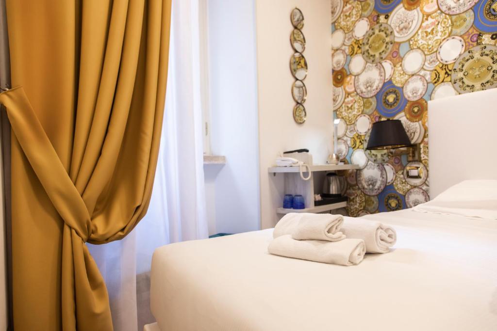 Postel nebo postele na pokoji v ubytování Hotel Cinquantatre