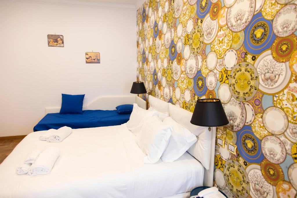 Postel nebo postele na pokoji v ubytování Hotel Cinquantatre