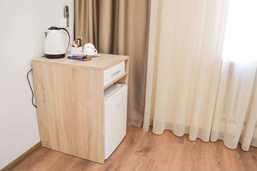 Příslušenství pro přípravu čaje a kávy v ubytování CentrRoomKiev