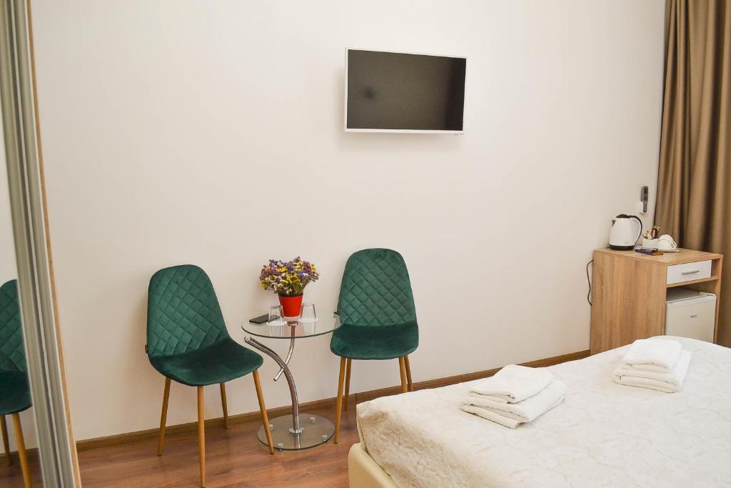 Postel nebo postele na pokoji v ubytování CentrRoomKiev