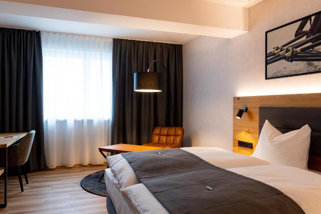Postel nebo postele na pokoji v ubytování mk hotel passau