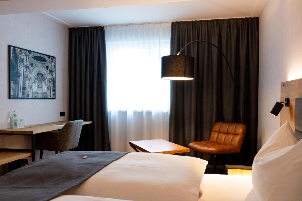 Postel nebo postele na pokoji v ubytování mk hotel passau