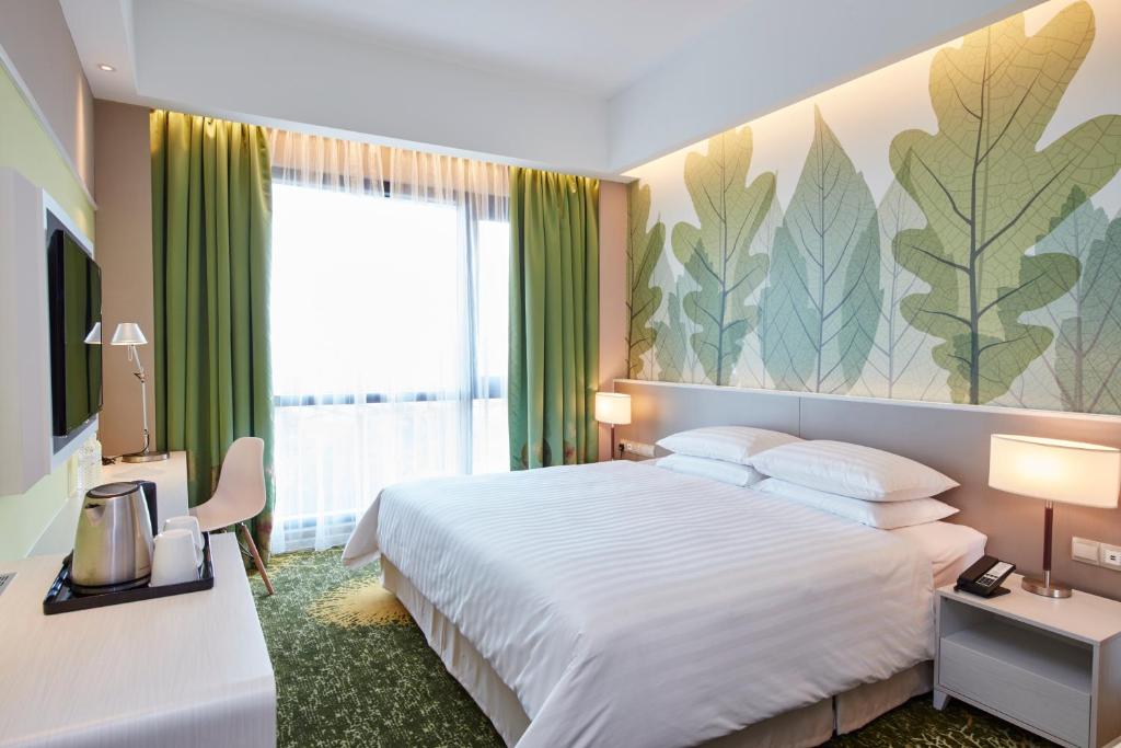 Postel nebo postele na pokoji v ubytování Sunway Velocity Hotel Kuala Lumpur