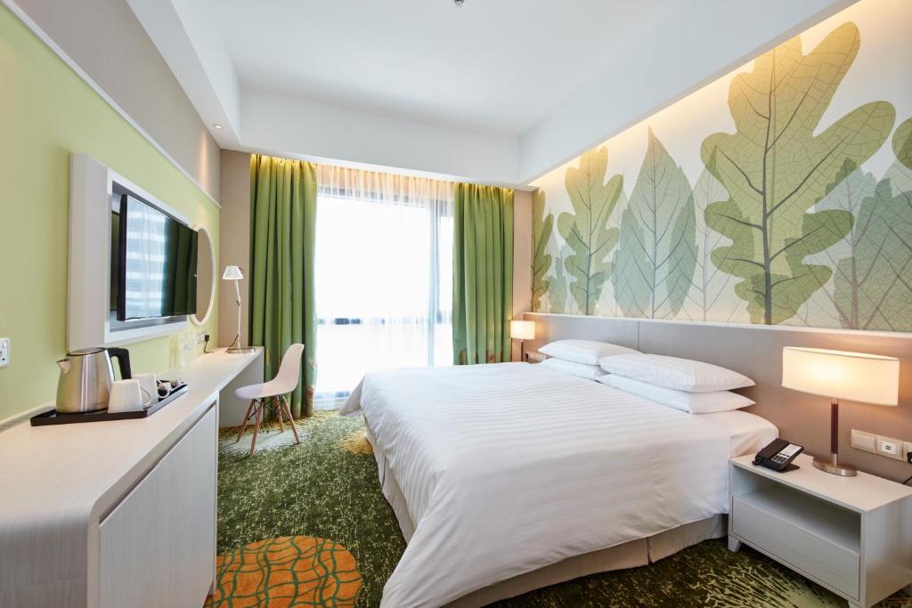 Postel nebo postele na pokoji v ubytování Sunway Velocity Hotel Kuala Lumpur