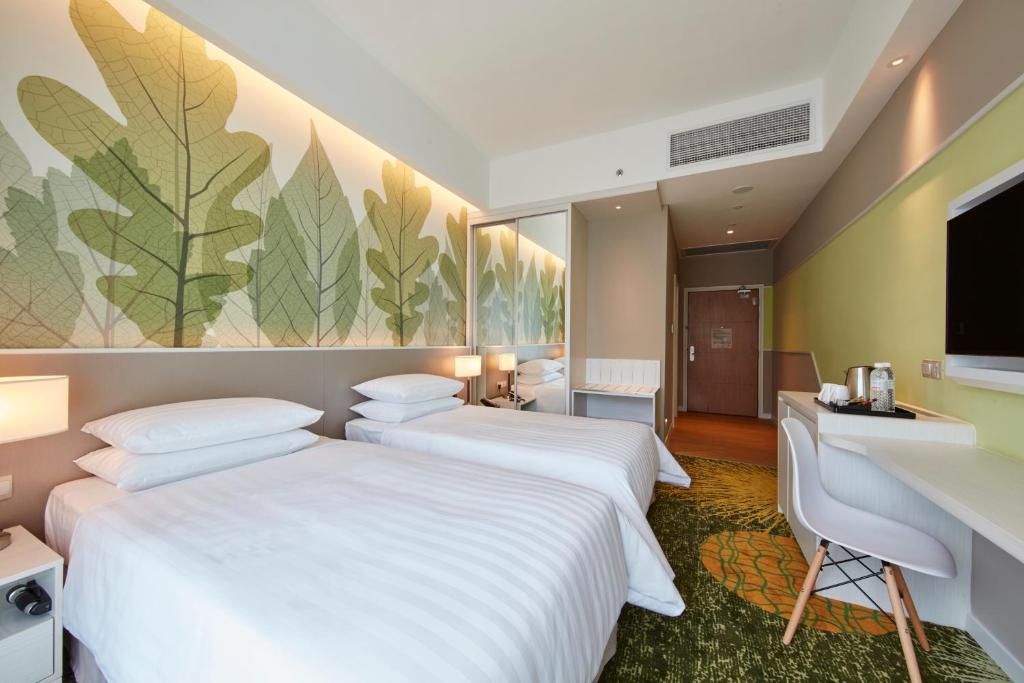Postel nebo postele na pokoji v ubytování Sunway Velocity Hotel Kuala Lumpur