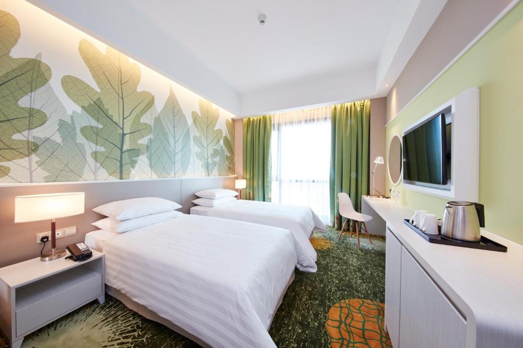 Postel nebo postele na pokoji v ubytování Sunway Velocity Hotel Kuala Lumpur