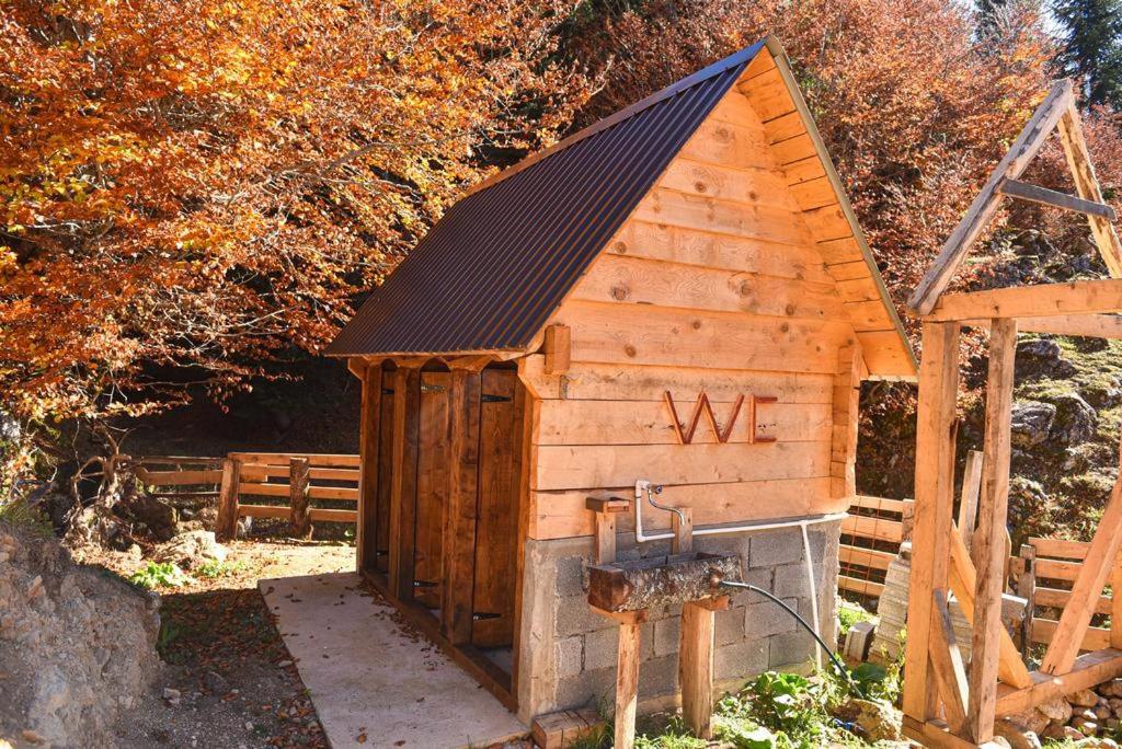 a wooden out house with the wordwk written on it at Dulović - KATUN POTOCI in Kolašin