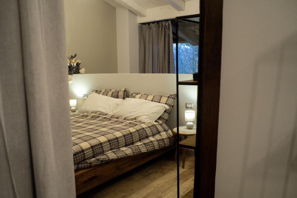 Postel nebo postele na pokoji v ubytování Locanda Vecchio Cipresso