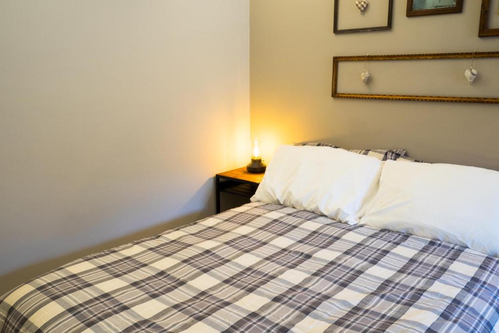 Postel nebo postele na pokoji v ubytování Locanda Vecchio Cipresso