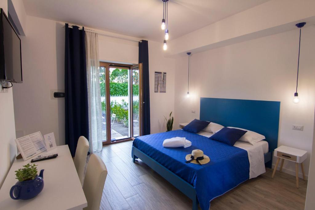 A bed or beds in a room at Maison Ligea