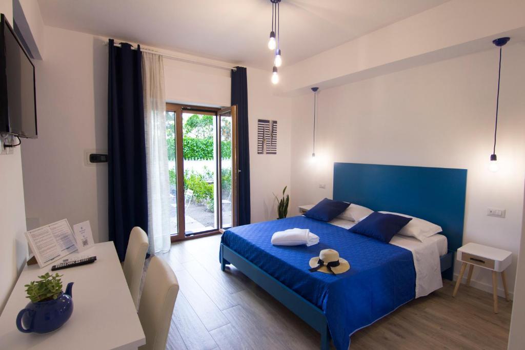 A bed or beds in a room at Maison Ligea