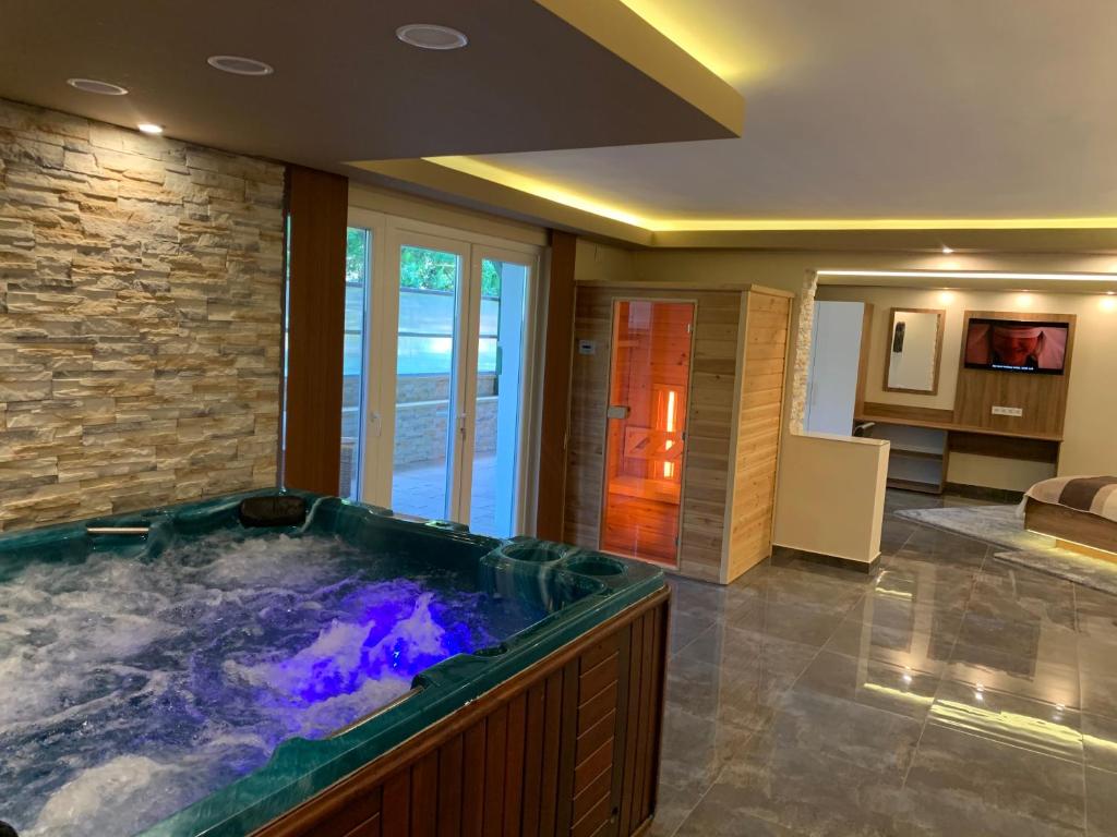 a large jacuzzi tub in a room at The Jakuzzi Room Miskolctapolca in Miskolc