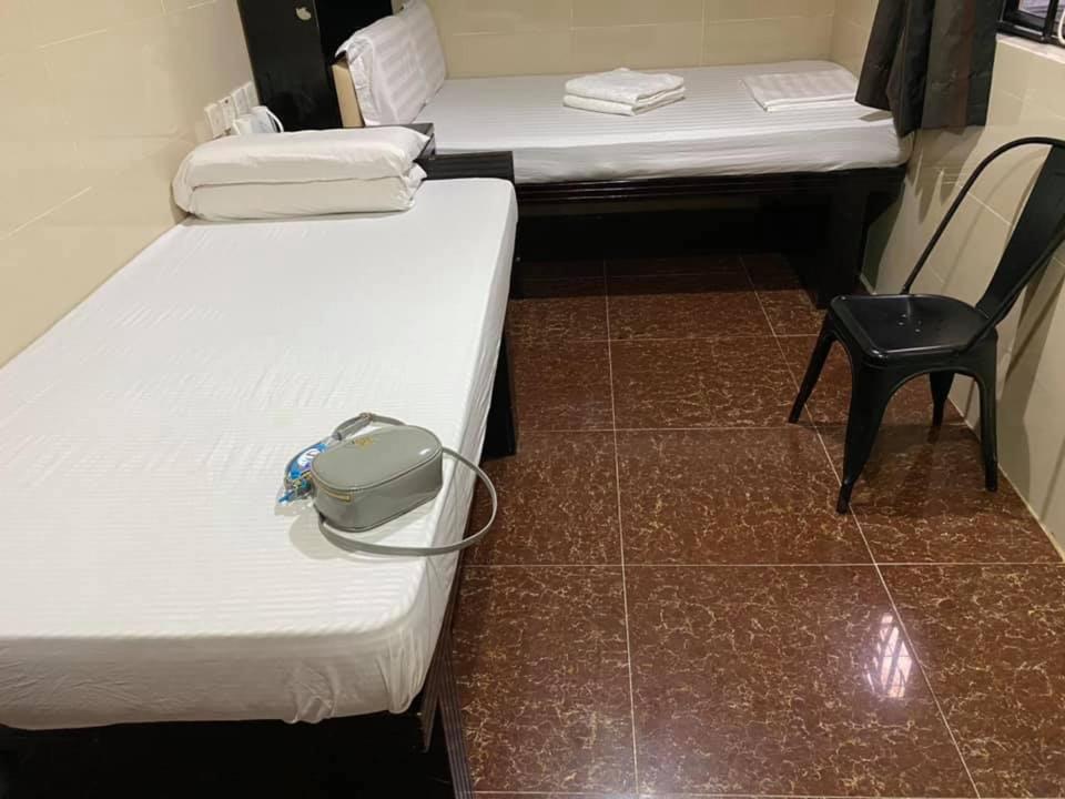 Postel nebo postele na pokoji v ubytování Nagaland Guesthouse