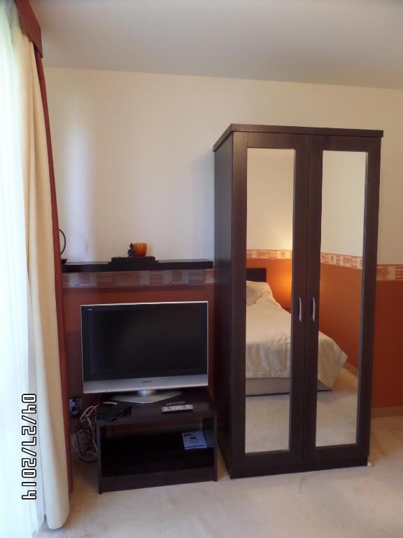 Postel nebo postele na pokoji v ubytování Nia Családi Apartman