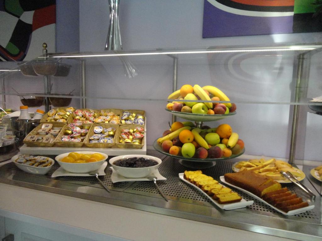 a buffet line with many different types of food at Aurea Hotel in Tortoreto Lido