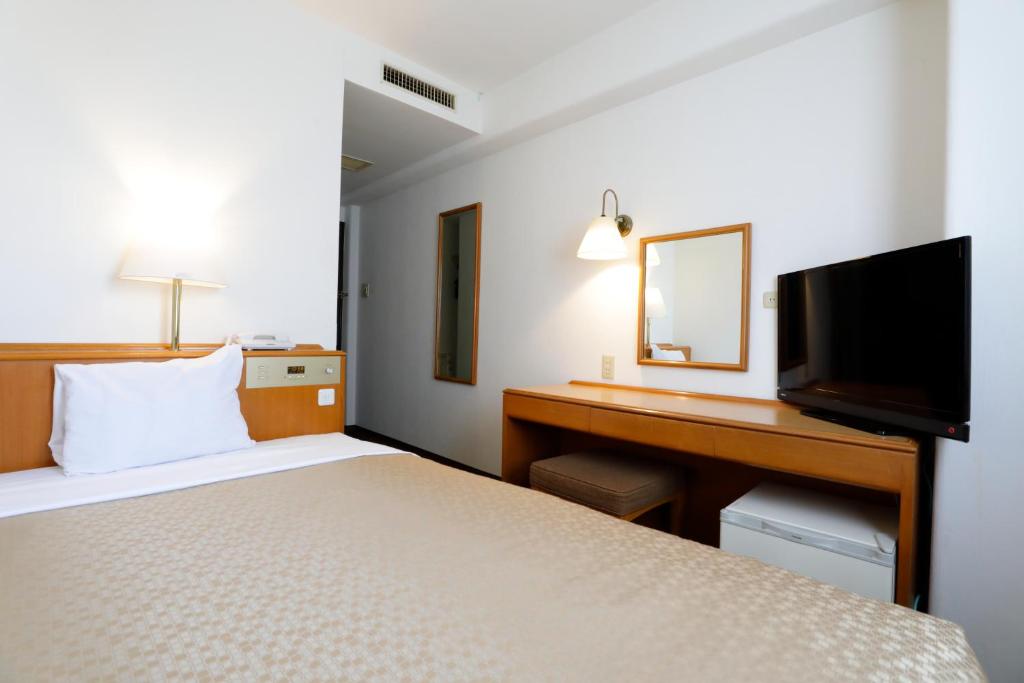 TV a/nebo společenská místnost v ubytování Kawasaki Central Hotel