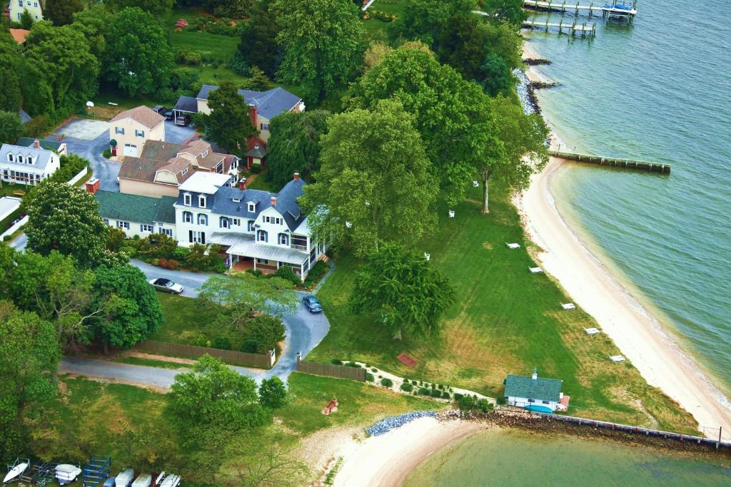 an aerial view of a house and a beach at Sandaway Suites & Beach in Oxford