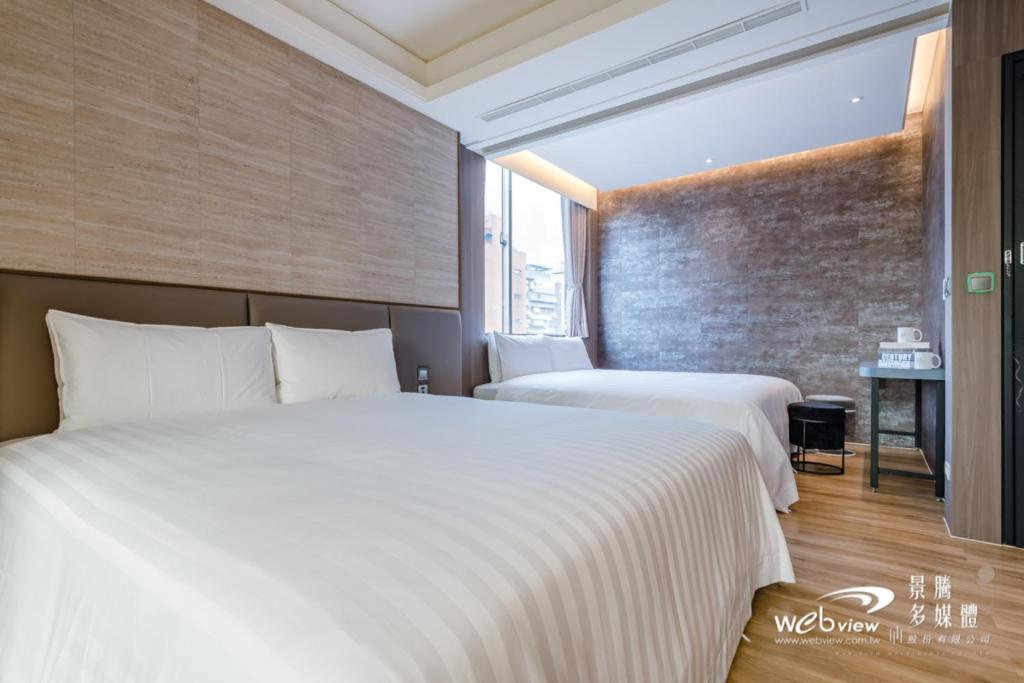 Postel nebo postele na pokoji v ubytování 玩行旅台北分館