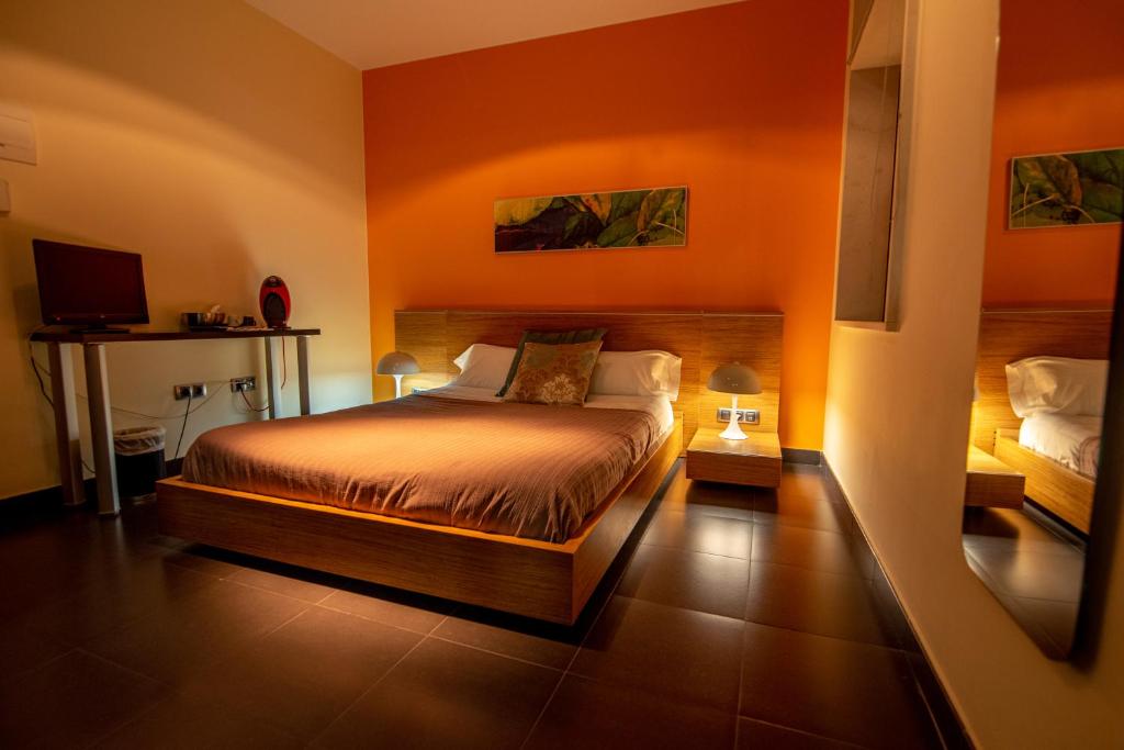En eller flere senge i et værelse på Hotel Los Nardos